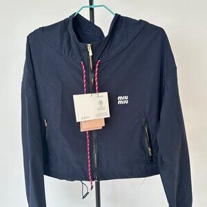 MIUMIU windbreaker, exquisitely tailored with a hood